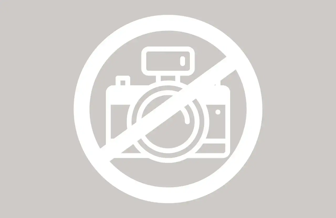 Icône de caméra barrée, symbolisant l'interdiction de photographier et le respect du droit à l'image.