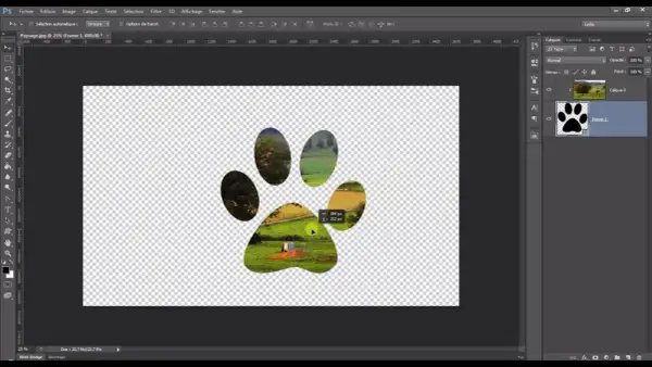 Un paysage est visible à travers les empreintes d'une patte, créant un effet de masque d'écretage Photoshop.